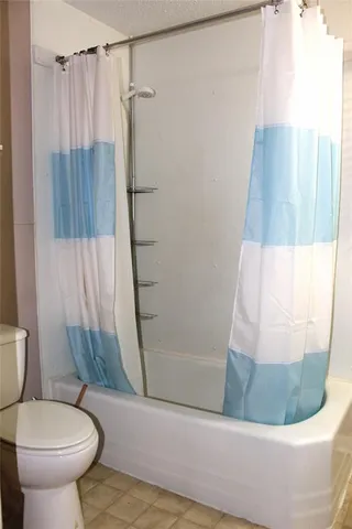 a bathroom with a sink and toilet