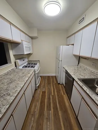 a kitchen that has a sink and a stove