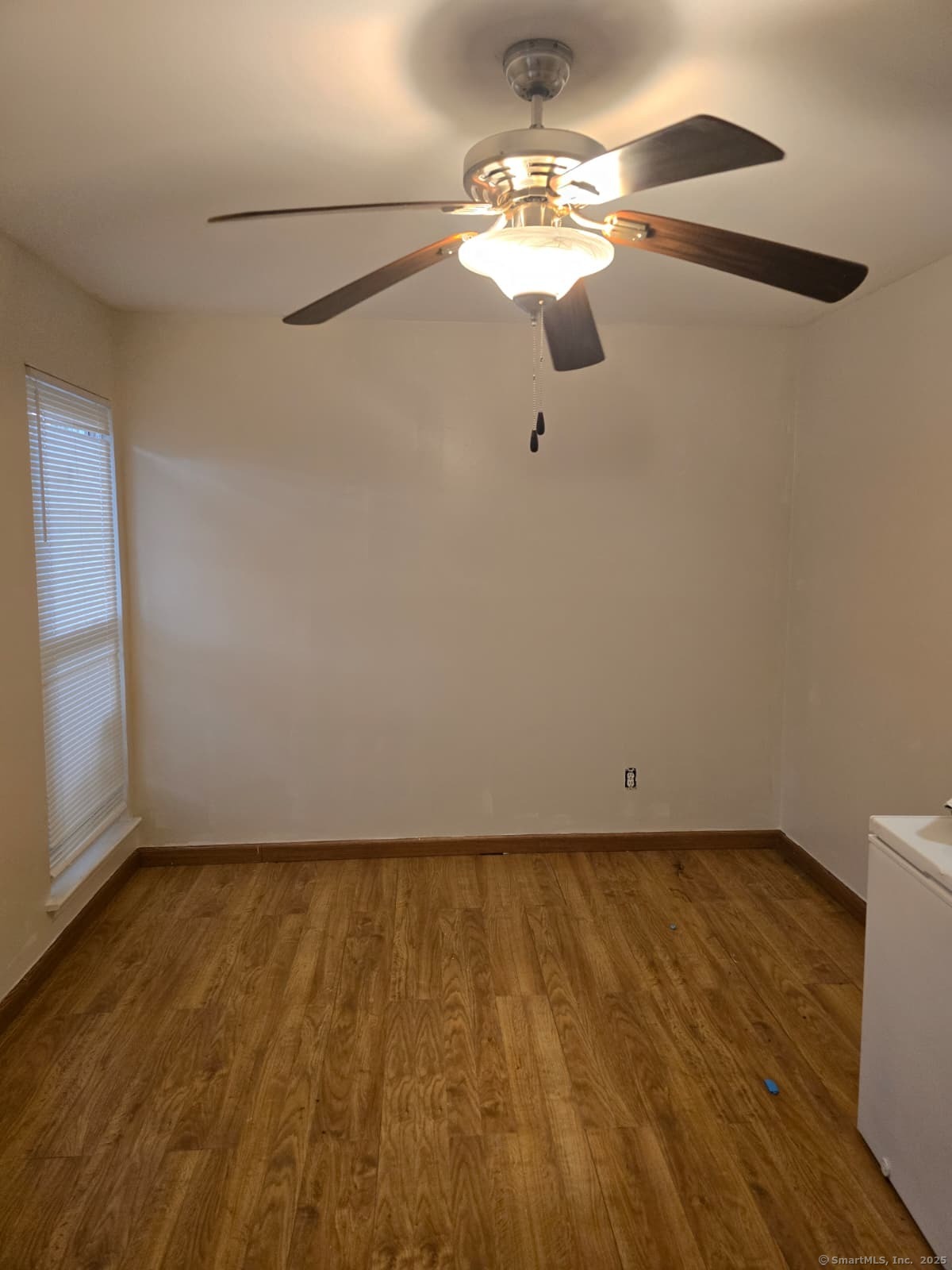 30 Glenview Drive, Unit 30 Cromwell, CT 06416 - Photo 6 of 22 a view of a room with wooden floor fan and window
