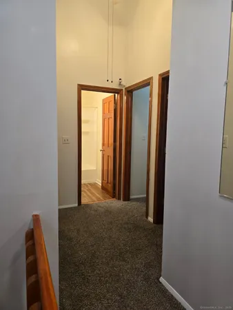 a view of a hallway with closet