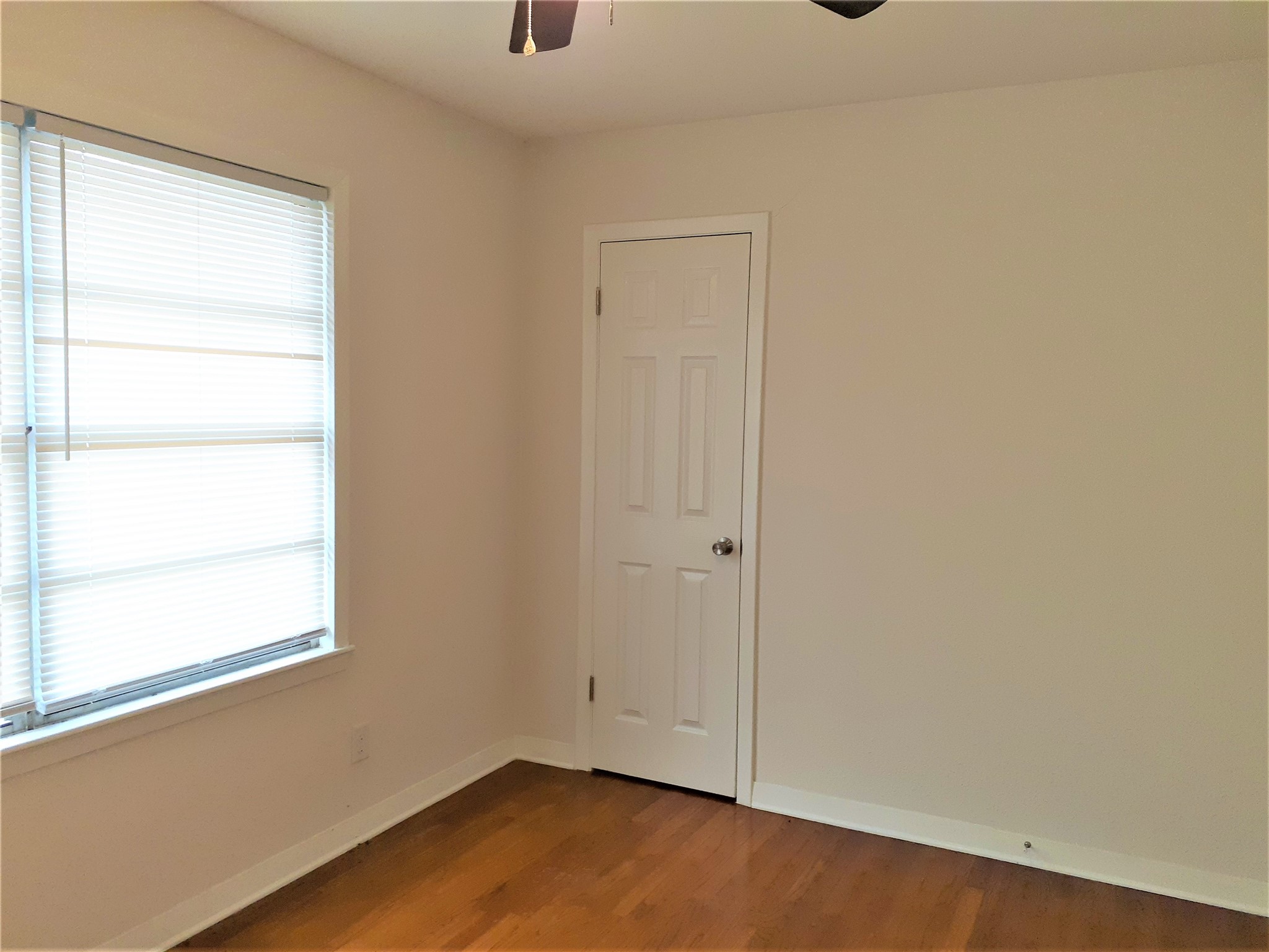 1213 Tobola Street Rosenberg, TX 77471 - Photo 7 of 8 a view of a small space with wooden floor and a window