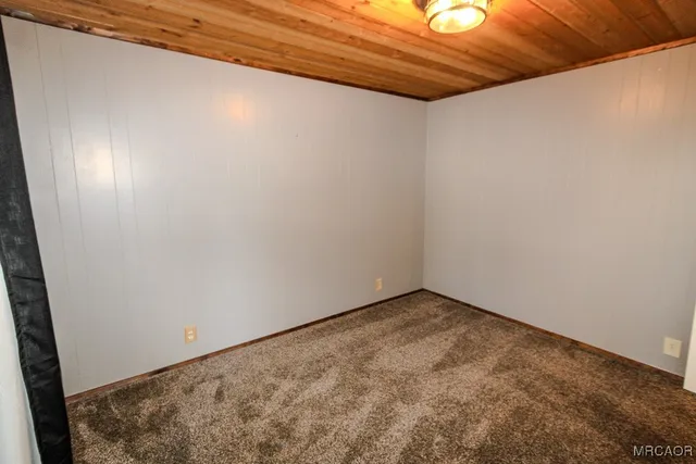 a bathroom with a sink a toilet and shower curtain