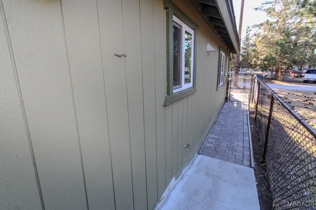 a view of backyard with small cabin