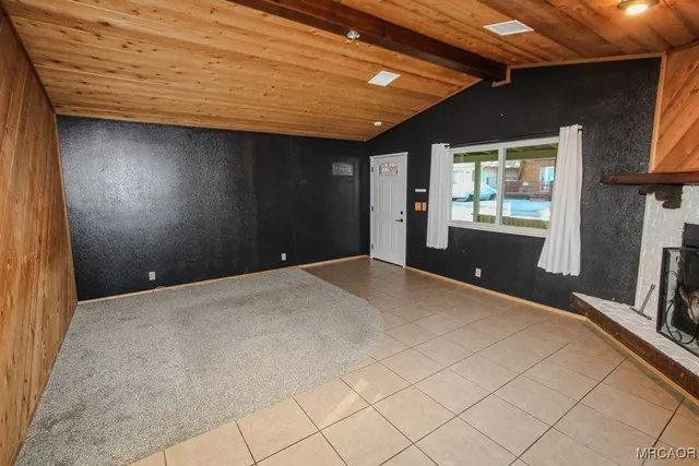 a view of a livingroom with furniture and staircase