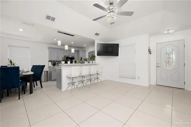 a view of kitchen with furniture and a flat screen tv