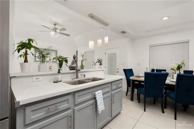 a view of kitchen sink table and chairs