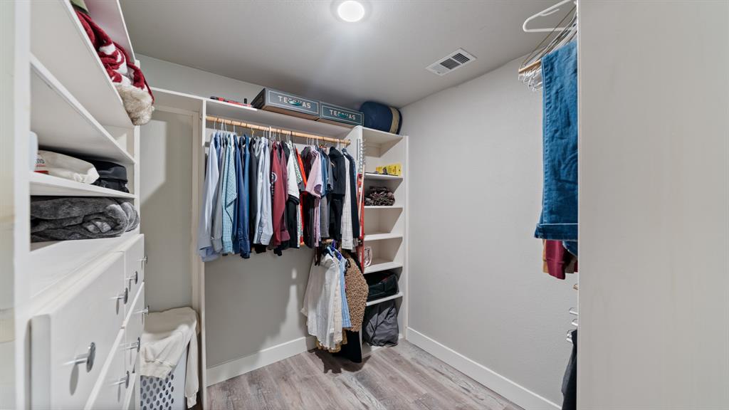 129 King Arthur Road Mabank, TX 75156 - Photo 12 of 33 a view of walk in closet with clothes and shoes