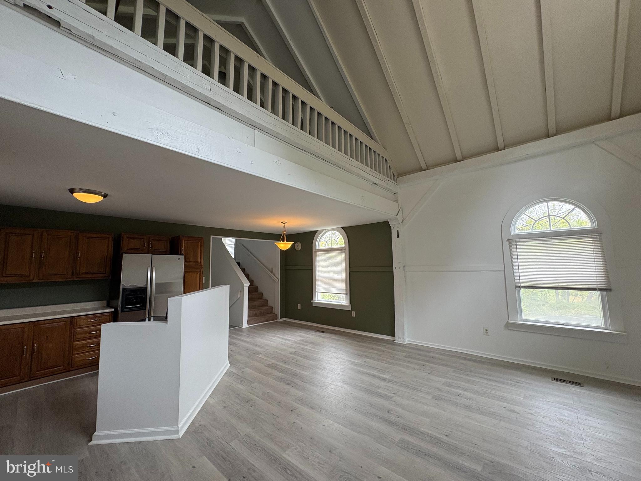 a view of entryway with kitchen