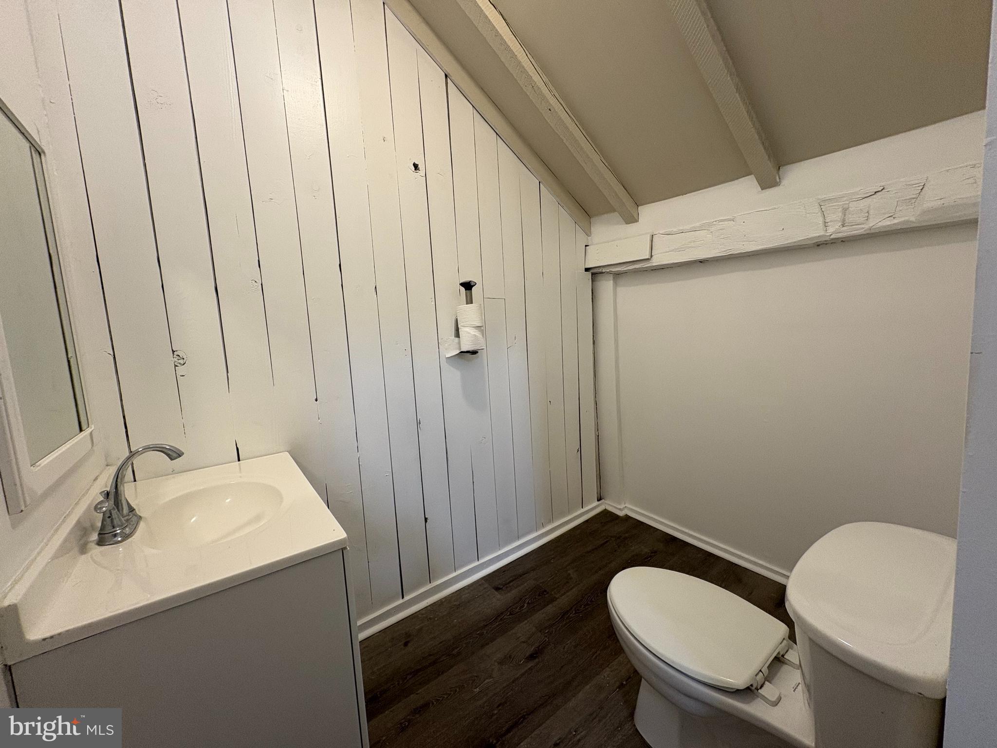 5001 Carroll Manor Road Baldwin, MD 21013 - Photo 13 of 18 a bathroom with a sink a toilet a mirror and shower
