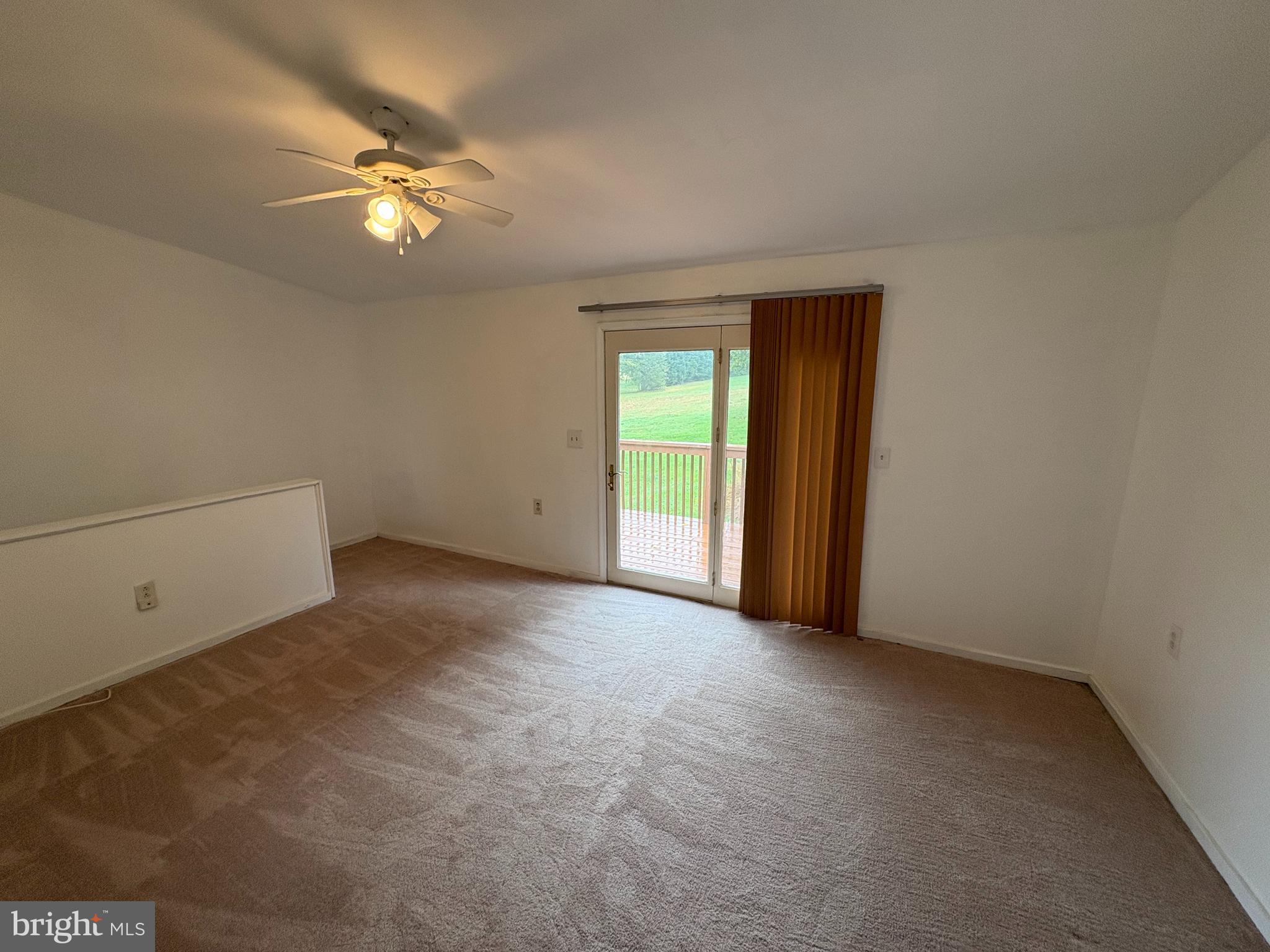 5001 Carroll Manor Road Baldwin, MD 21013 - Photo 16 of 18 a view of an empty room with a chandelier fan