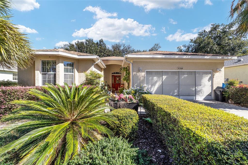 8364 Southwest 79th Circle Ocala, FL 34476 - Photo 1 of 40 a view of a house with a small yard and plants