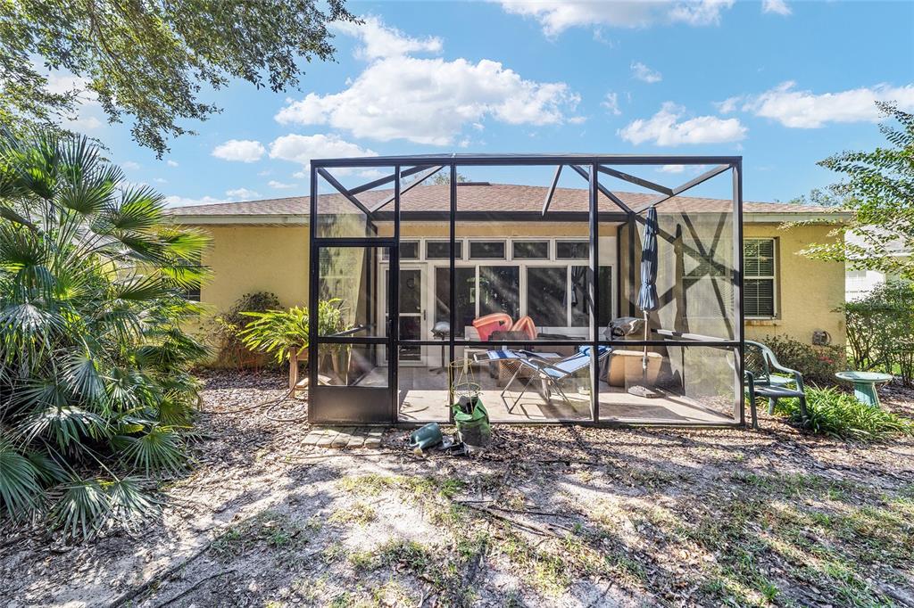 8364 Southwest 79th Circle Ocala, FL 34476 - Photo 38 of 40 a view of a chair and table in the backyard