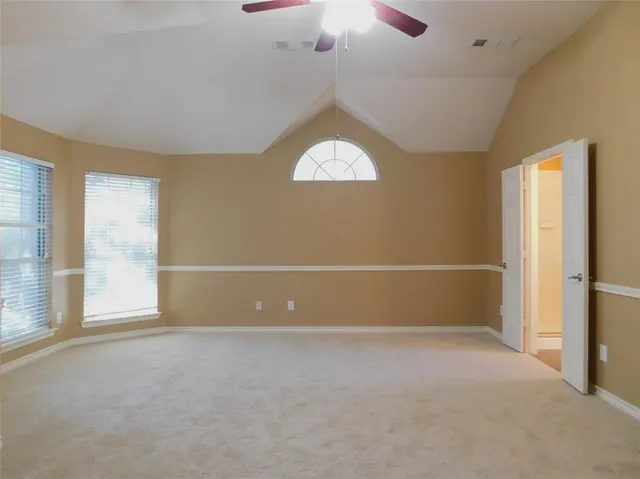 an empty room with a empty space and a window