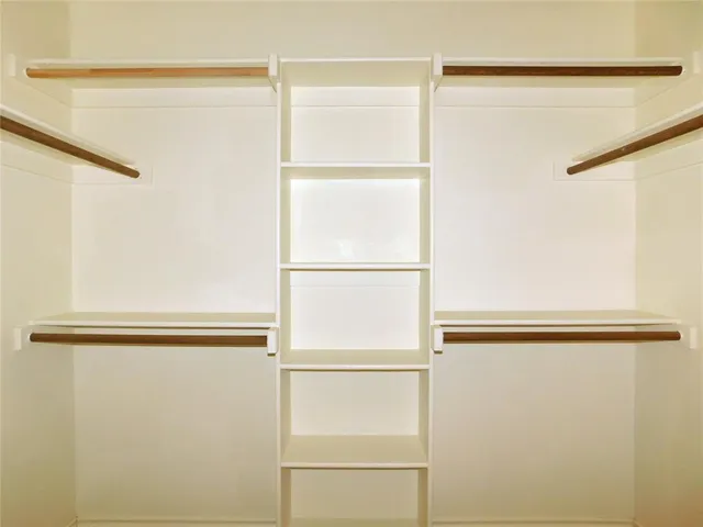 a close view of closet with wooden floor