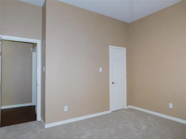 an empty room with closet area