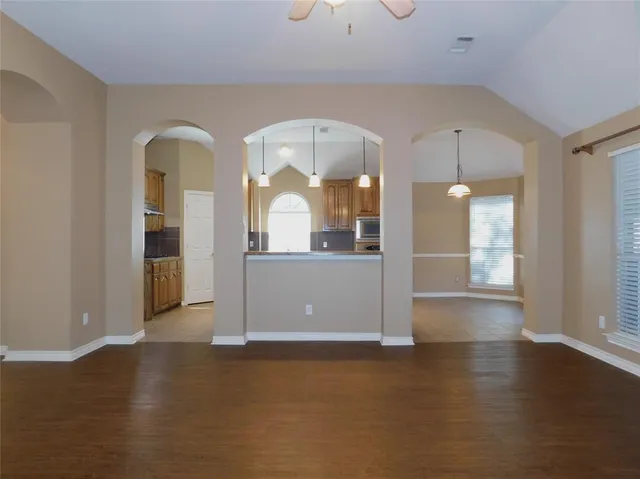 a view of a living room with wooden floor