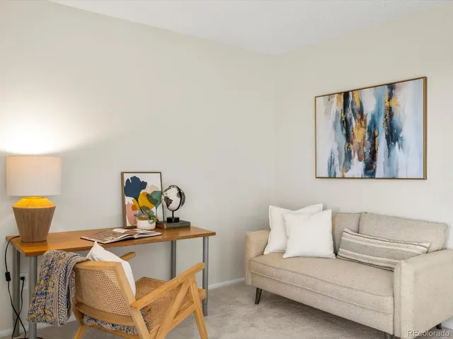a bathroom with a toilet mirror and sink