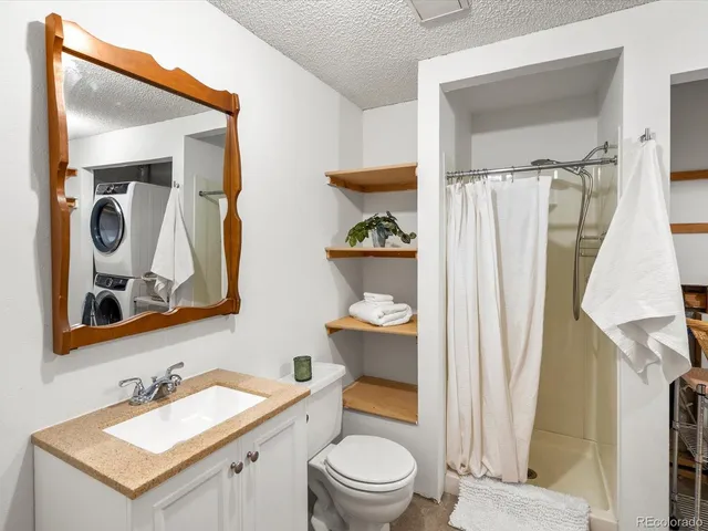 a view of storage and utility room with washer and dryer