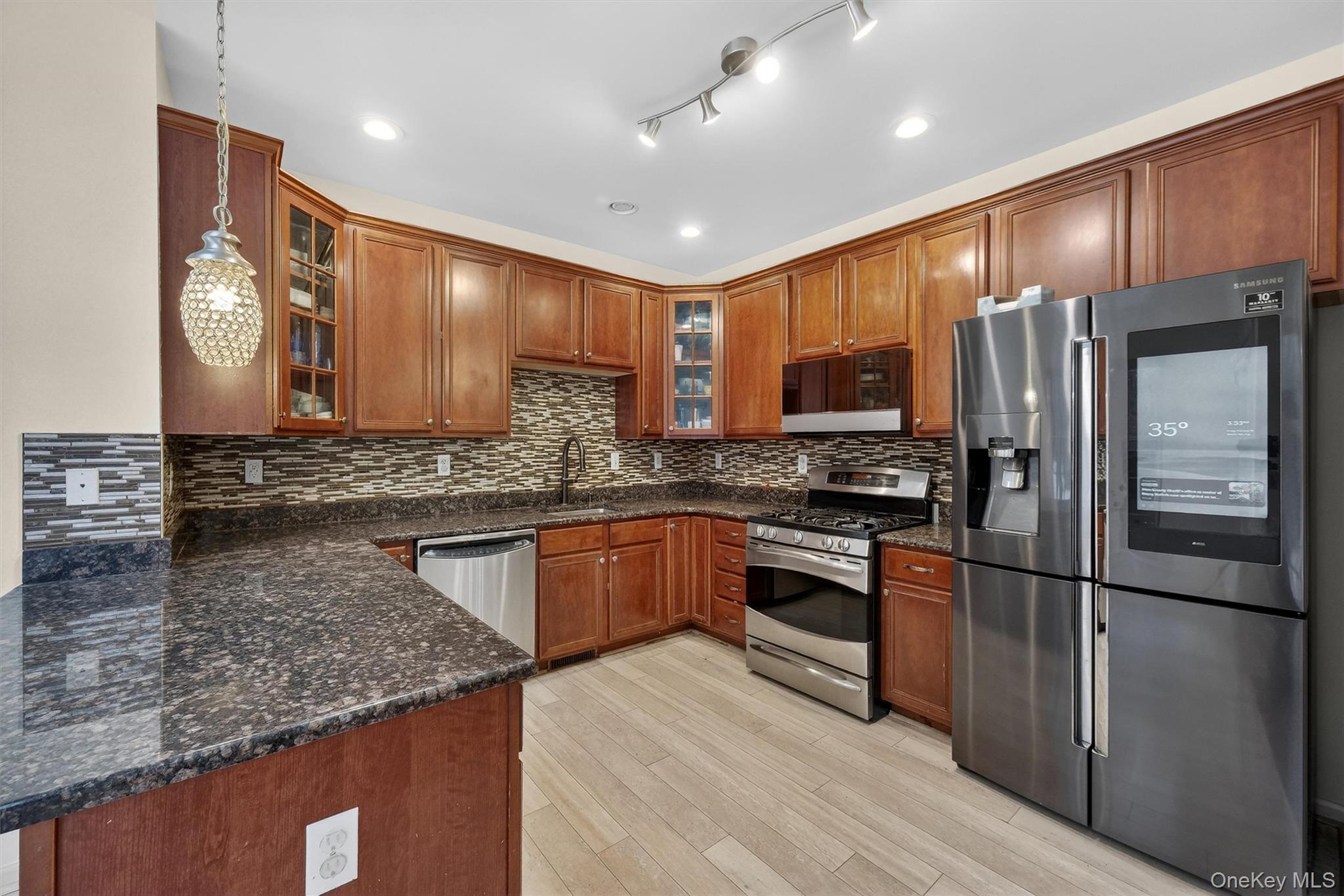 1123 Cold Spring Road Fishkill, NY 12524 - Photo 12 of 44 a kitchen with stainless steel appliances granite countertop a refrigerator a stove and a sink