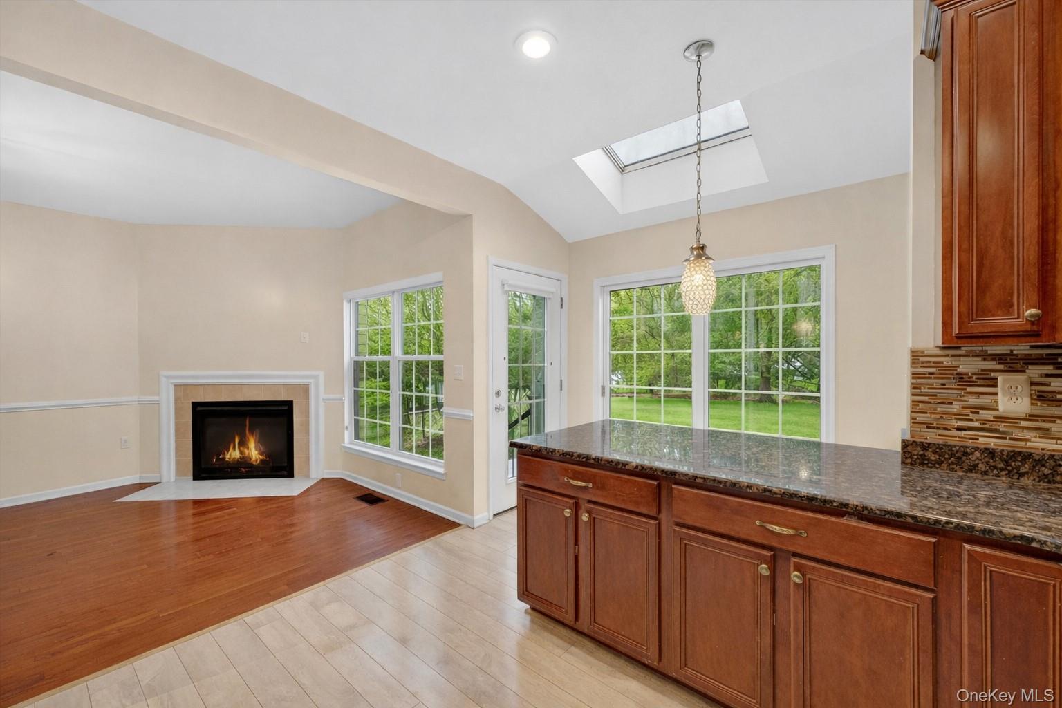 1123 Cold Spring Road Fishkill, NY 12524 - Photo 15 of 44 a open kitchen with granite countertop a stove a sink and a wooden floors