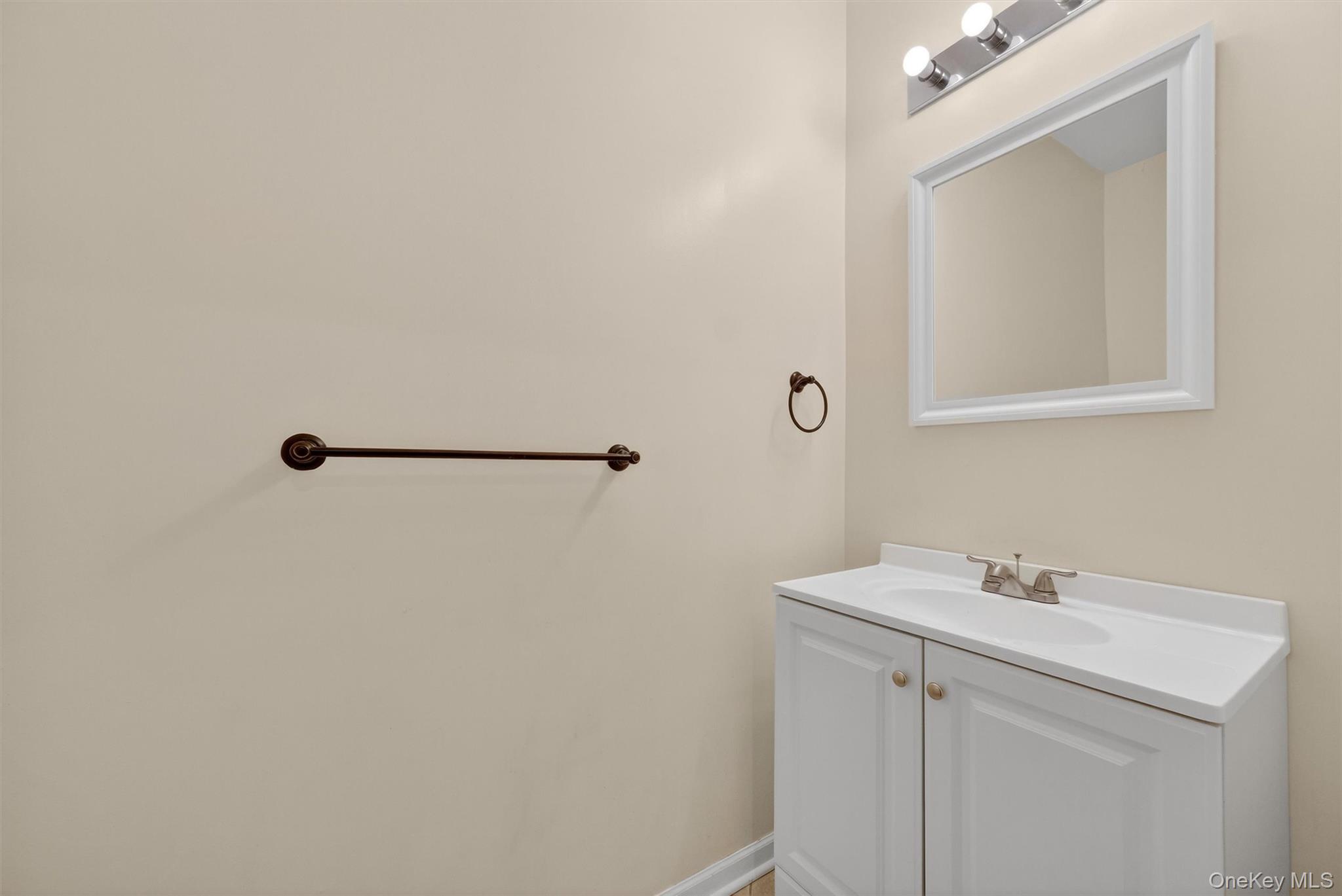1123 Cold Spring Road Fishkill, NY 12524 - Photo 18 of 44 a bathroom with a sink and mirror