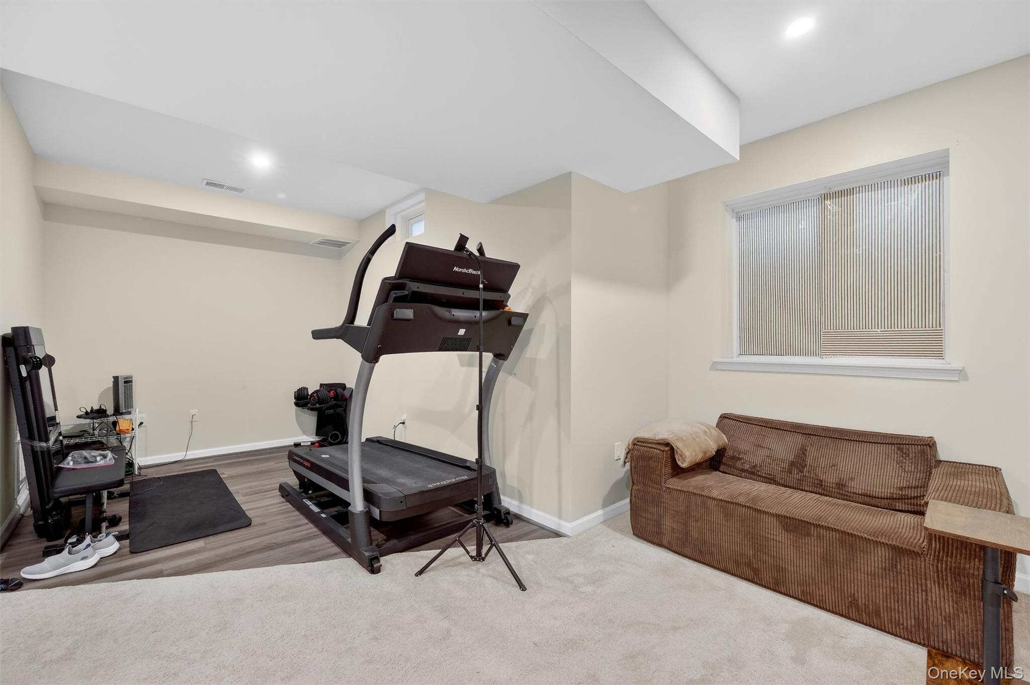 1123 Cold Spring Road Fishkill, NY 12524 - Photo 21 of 44 a living room with furniture a air conditioner and a couch