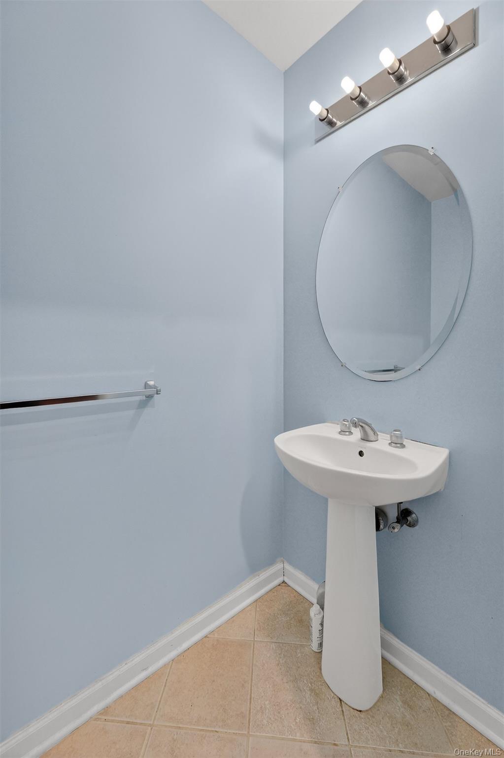 1123 Cold Spring Road Fishkill, NY 12524 - Photo 23 of 44 a bathroom with a sink a mirror and vanity