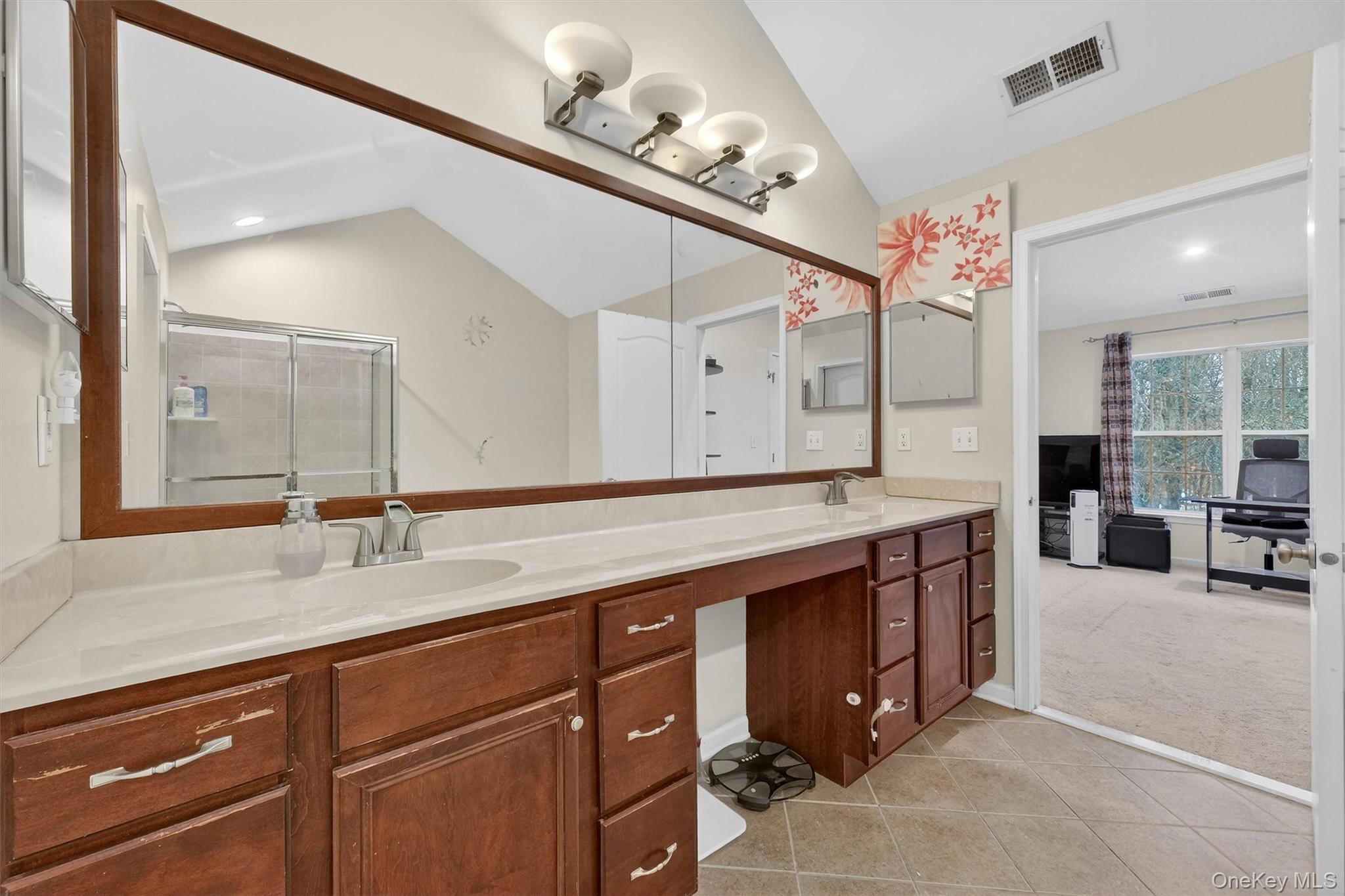 1123 Cold Spring Road Fishkill, NY 12524 - Photo 27 of 44 a spacious bathroom with a granite countertop sink a large mirror and a shower