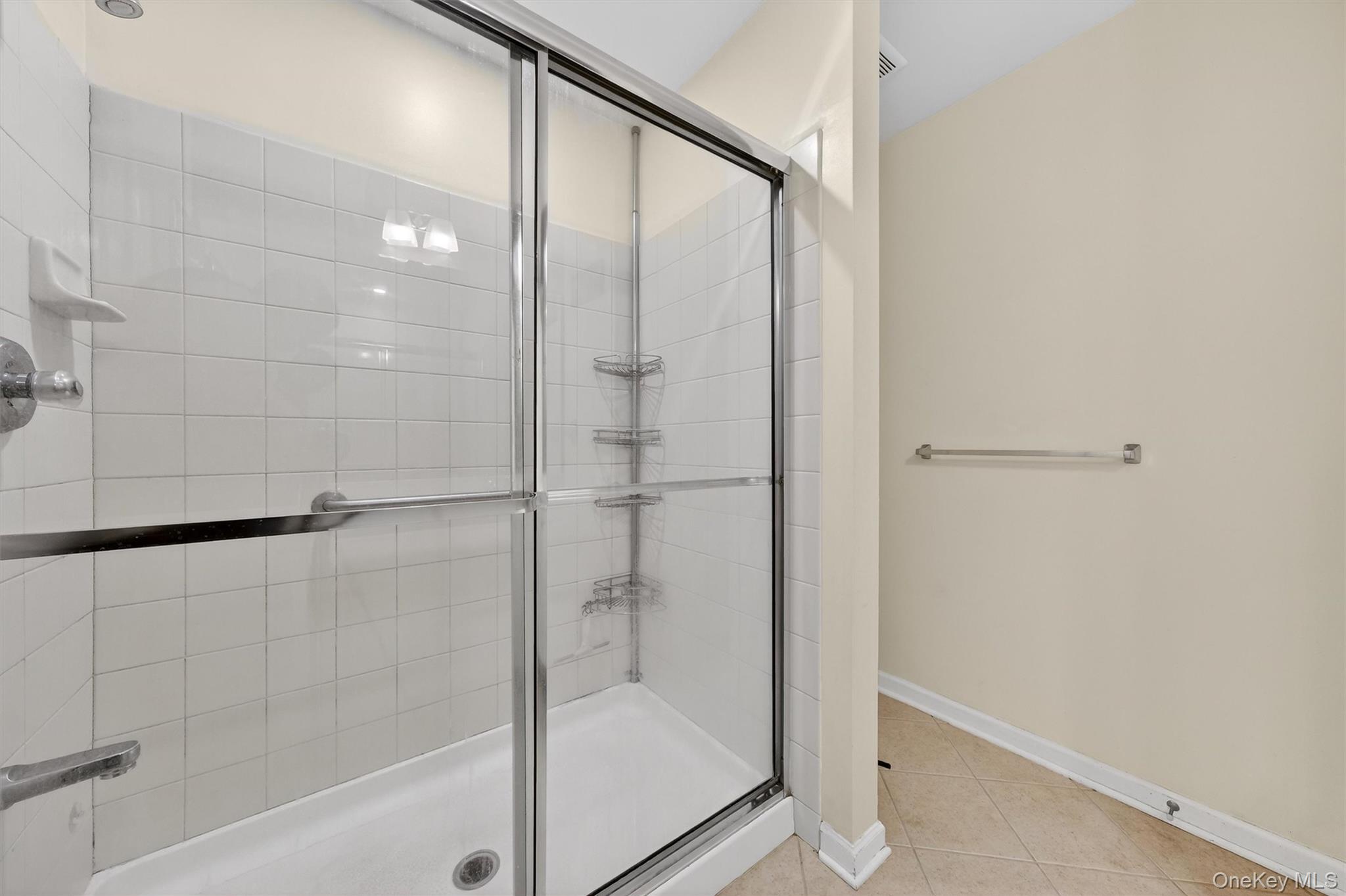 1123 Cold Spring Road Fishkill, NY 12524 - Photo 34 of 44 a bathroom with a glass shower door