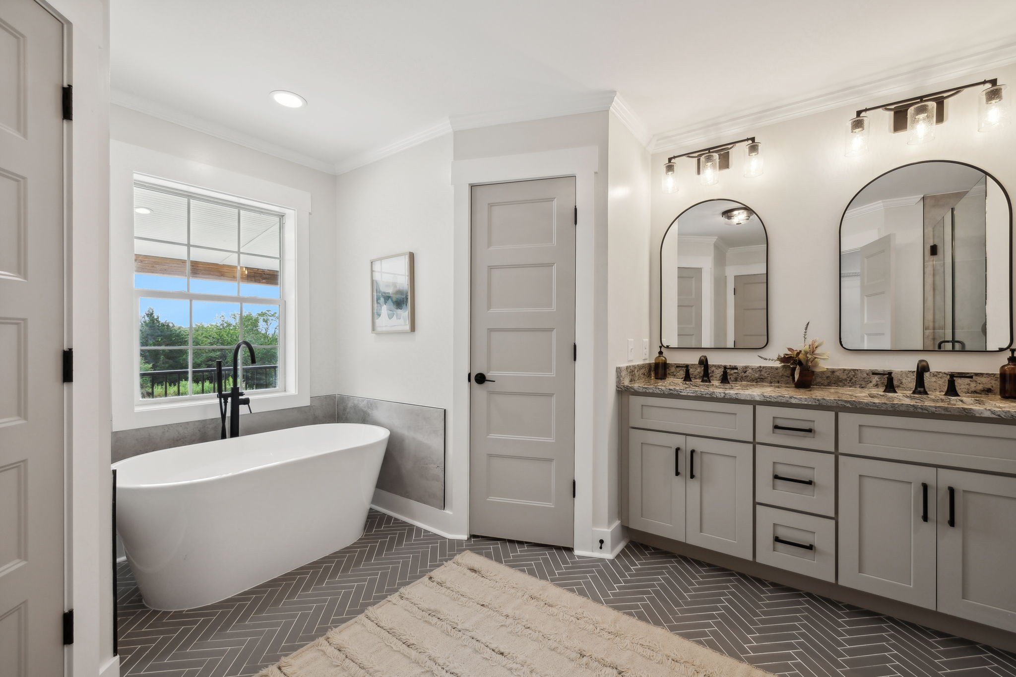 4739 Beech Log Road Lebanon, TN 37090 - Photo 16 of 33 a spacious bathroom with a double vanity sink a mirror and a bathtub
