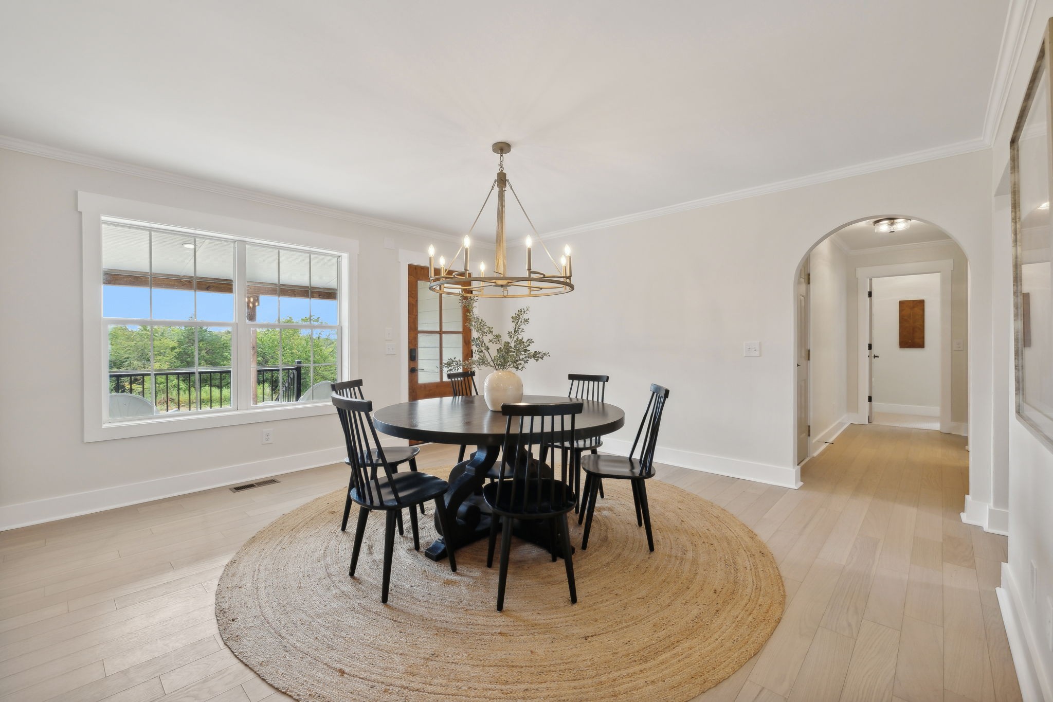 4739 Beech Log Road Lebanon, TN 37090 - Photo 7 of 33 a dining room with furniture a chandelier and wooden floor