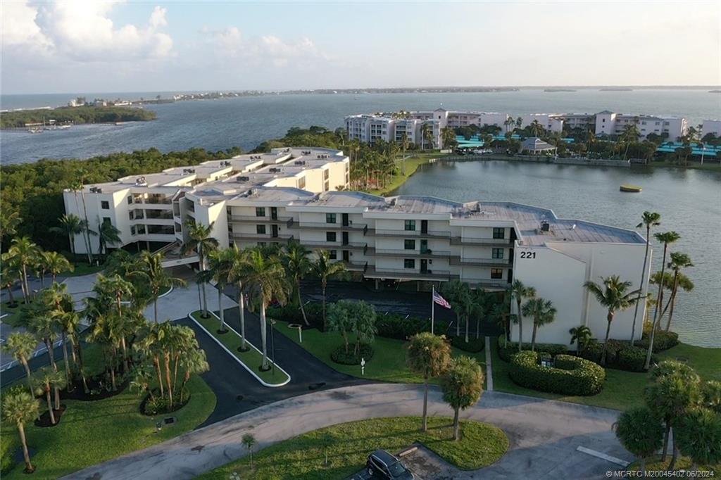 221 Northeast Plantation Road, Unit 215 Stuart, FL 34996 - Photo 2 of 83 an aerial view of a house with outdoor space and lake view