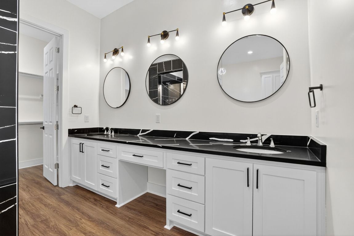 1035 Brandywine Court Elgin, TX 78621 - Photo 14 of 26 a bathroom with a granite countertop double vanity sink and a mirror