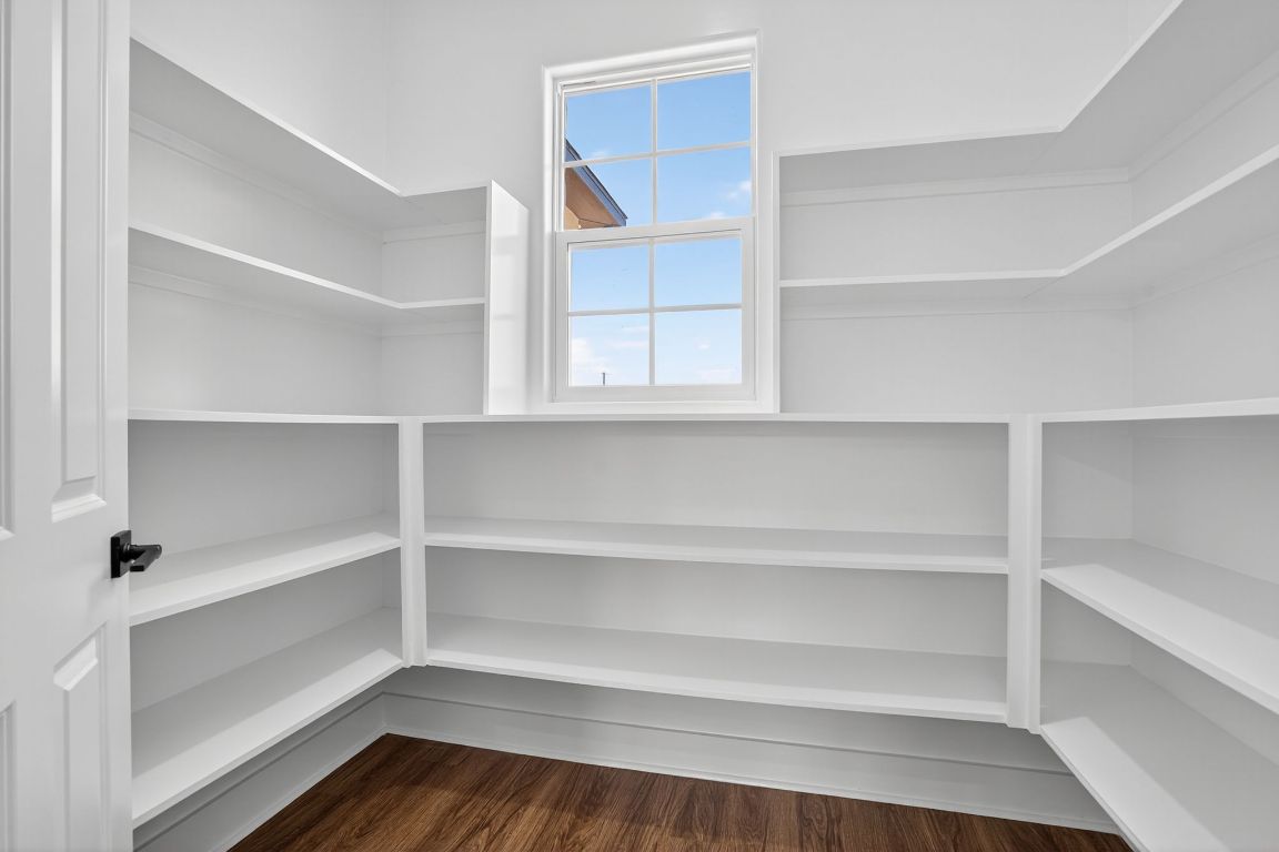 1035 Brandywine Court Elgin, TX 78621 - Photo 18 of 26 a view of walk in closet with empty racks