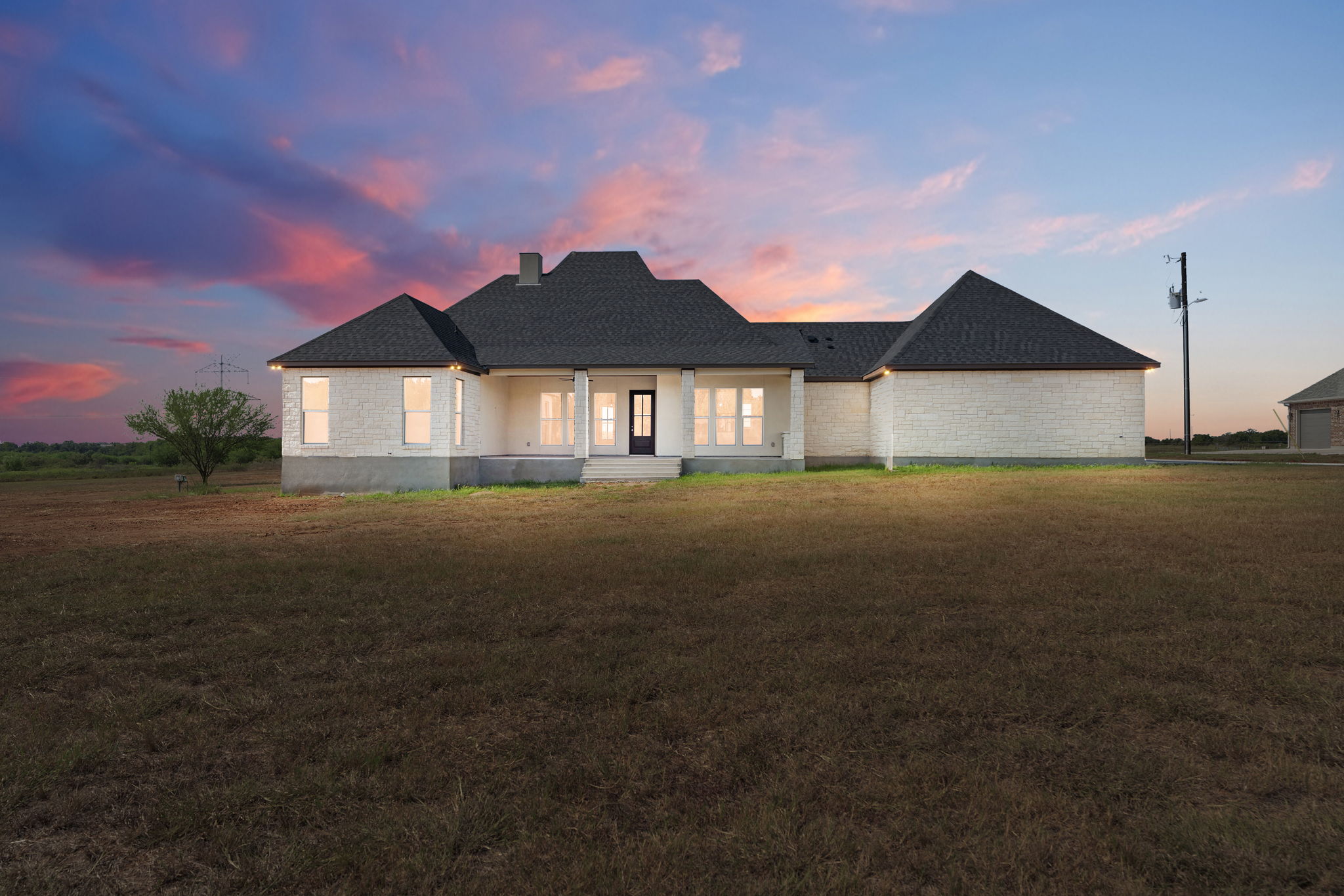 1035 Brandywine Court Elgin, TX 78621 - Photo 22 of 26 a front view of a house with a garden