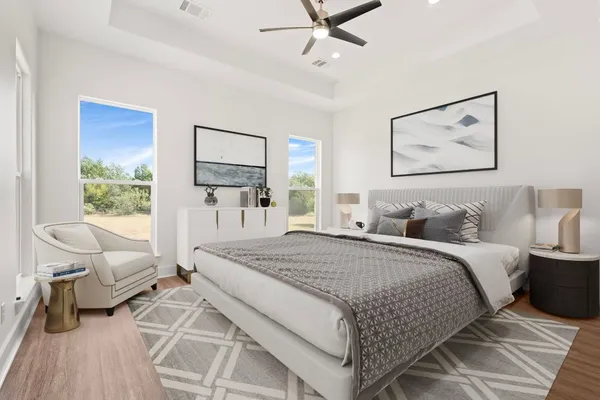 a spacious bedroom with a large bed and a window