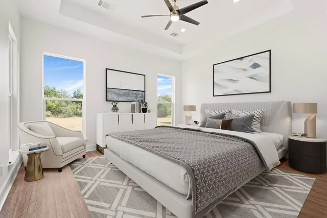 a spacious bedroom with a large bed and a window