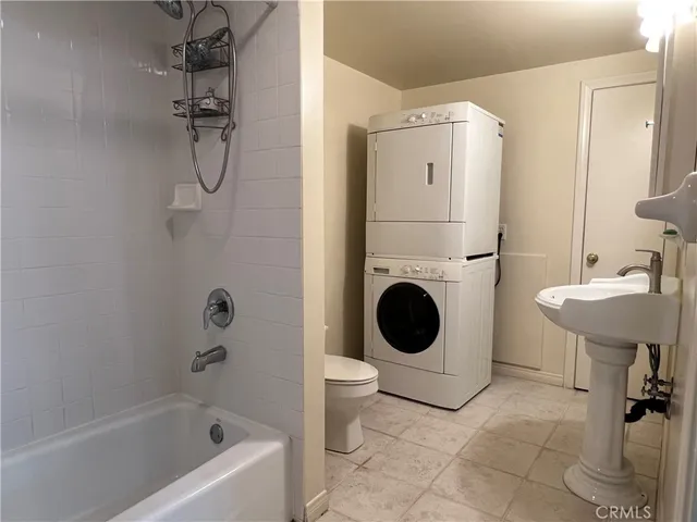 a bathroom with a sink a toilet and a bathtub