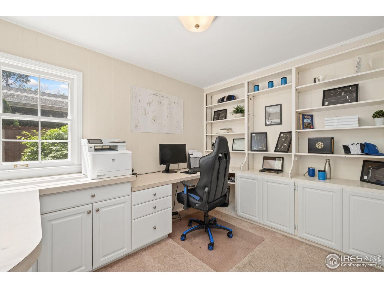 2114 18th Street Road Greeley, CO 80631 - Photo 17 of 35 Office on main level with built-in desk and shelving