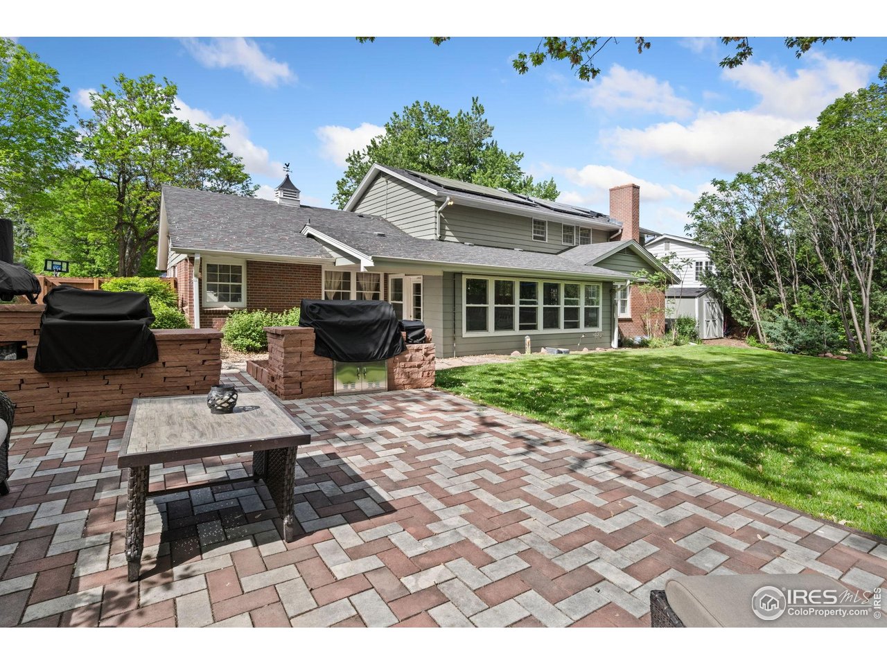 2114 18th Street Road Greeley, CO 80631 - Photo 33 of 35 New outdoor patio with built-ins for gas grills, gorgeous!