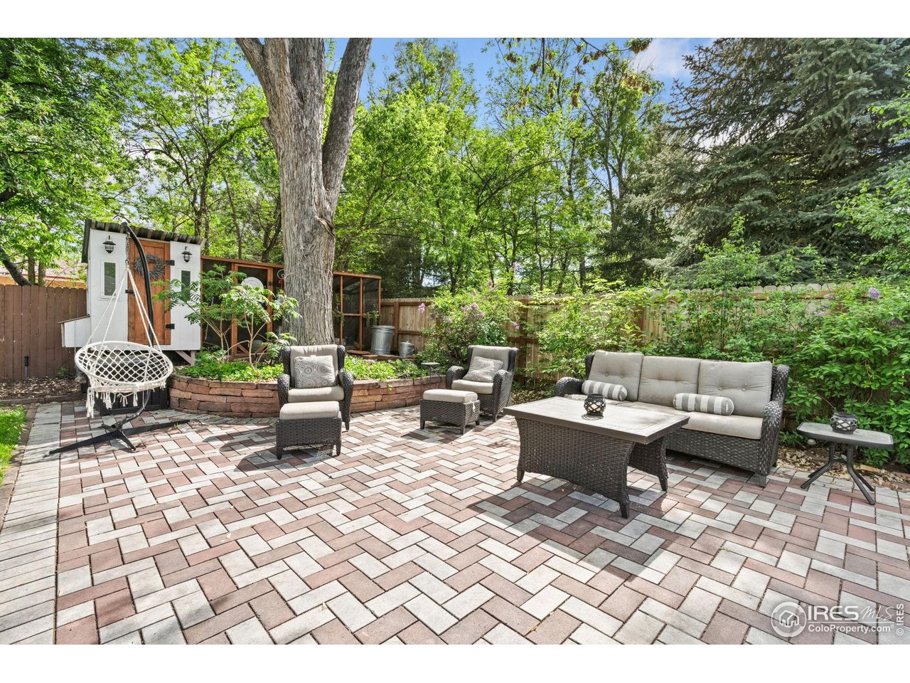 2114 18th Street Road Greeley, CO 80631 - Photo 35 of 35 Shaded by the large tree, you will love these outdoor spaces! Don't miss the adorable chicken coop!