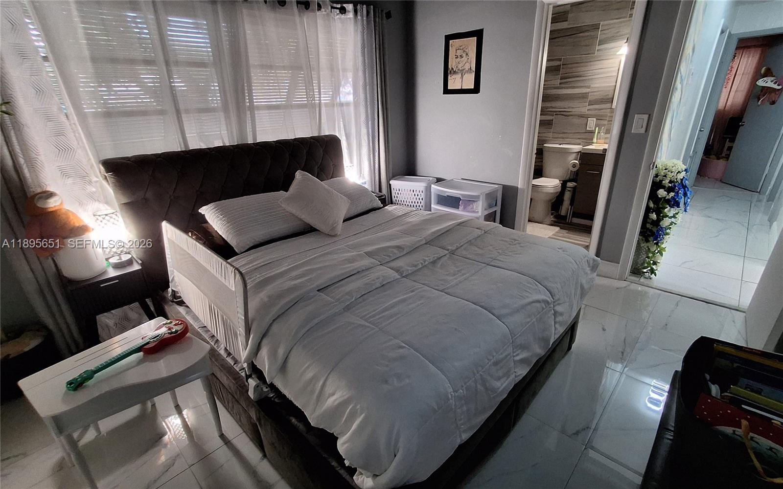 10305 Southwest 149th Terrace Miami, FL 33176 - Photo 2 of 58 a bedroom with a bed and a fireplace