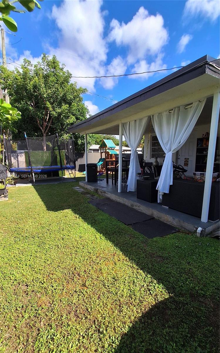 10305 Southwest 149th Terrace Miami, FL 33176 - Photo 29 of 58 a view of a house with backyard