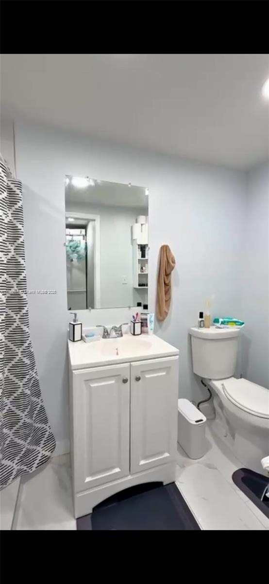 10305 Southwest 149th Terrace Miami, FL 33176 - Photo 33 of 39 a view of bathroom with a toilet sink and mirror