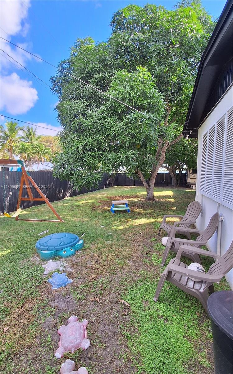 10305 Southwest 149th Terrace Miami, FL 33176 - Photo 38 of 58 a view of a backyard with swimming pool