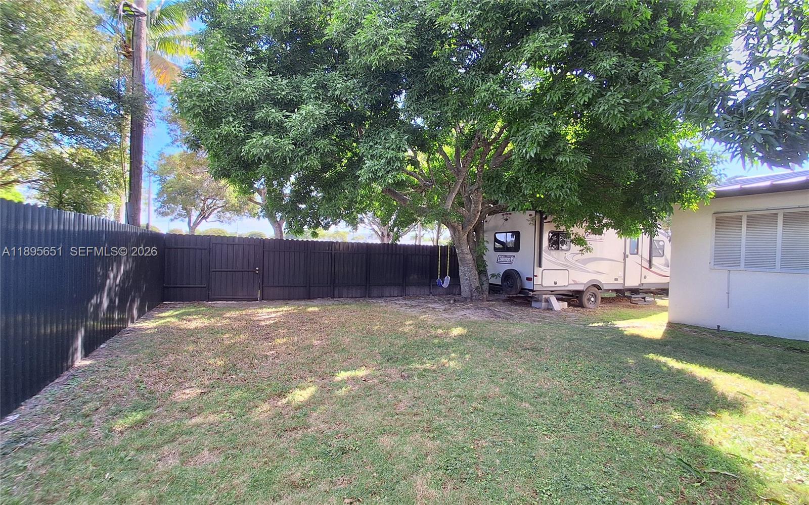 10305 Southwest 149th Terrace Miami, FL 33176 - Photo 52 of 58 a view of a backyard with tree