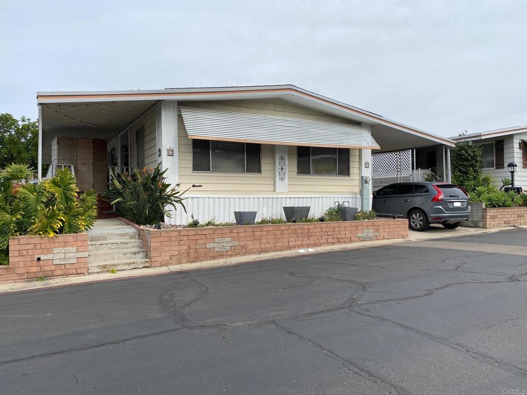 a view of a car parked front of a house