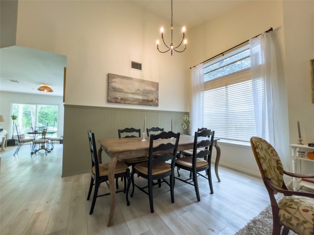 8908 West Hove Loop Austin, TX 78749 - Photo 12 of 20 a view of a dining room with furniture window and wooden floor
