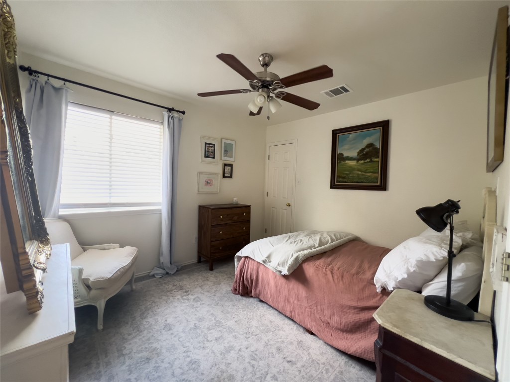 8908 West Hove Loop Austin, TX 78749 - Photo 13 of 20 a bedroom with a bed and wooden floor