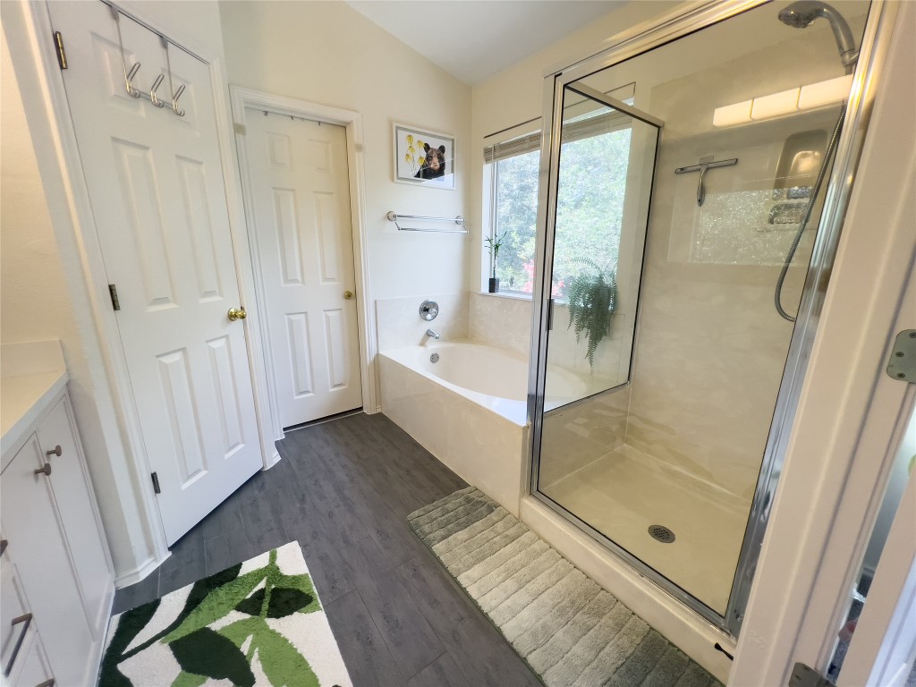 8908 West Hove Loop Austin, TX 78749 - Photo 19 of 20 a bathroom with a tub shower vanity and a sink